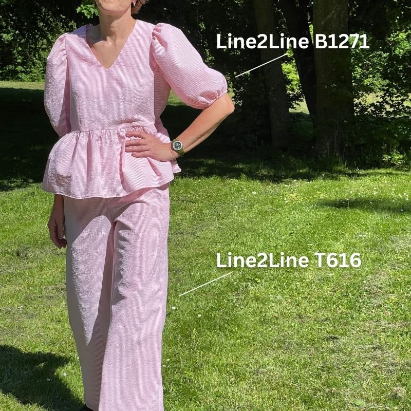 B1271 Peplum bluse med pufærmer og elastik